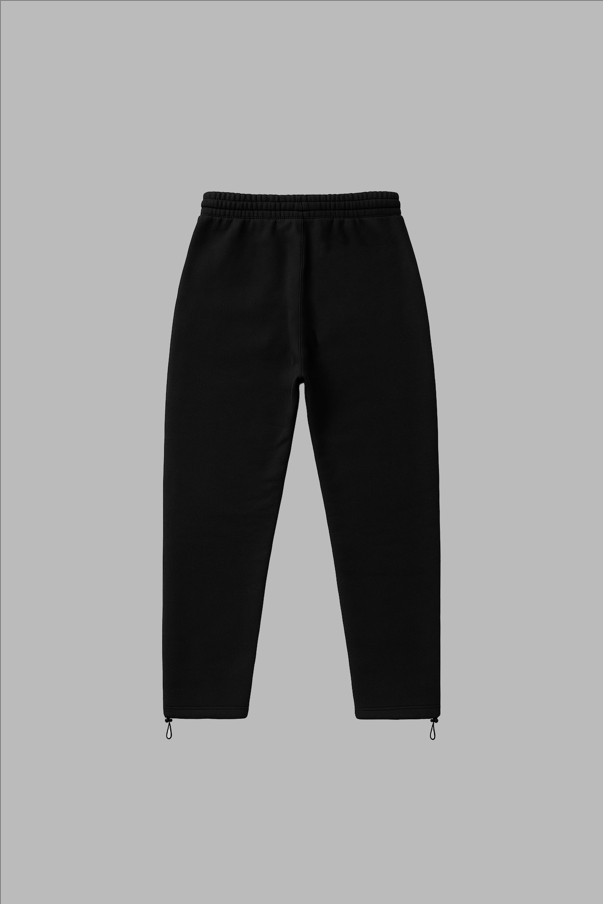 Trackpant Noir - Confort Minimaliste en coton 100%, coupe droite unisexe avec chevilles zippées. Pantalon streetwear ECLIPSE 12LUNES en précommande.